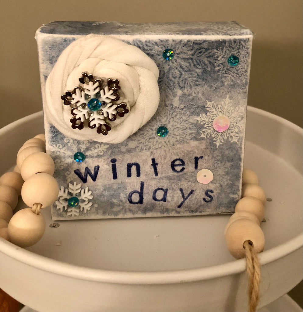 Winter themed snowflakes shelf sitter made with napkins for decoupage