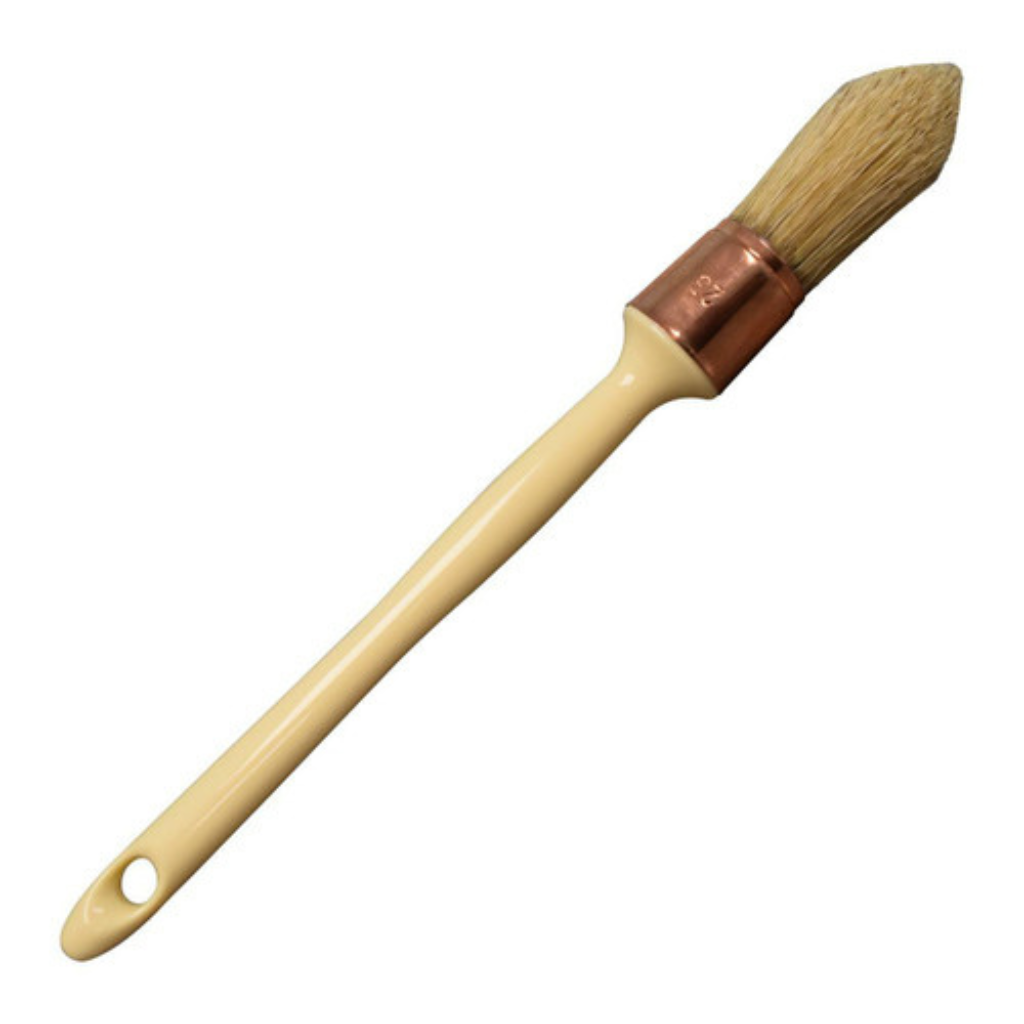 Dixie Belle French tip brush with natural tan handles and a beige plastic handle.