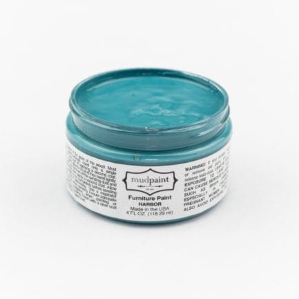 Medium blue Harbor Clay paint by Mudpaint. Colored paint in 4 oz jar