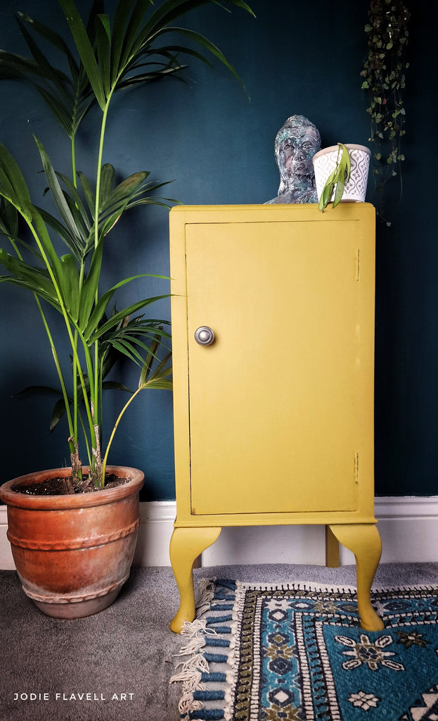yellow stone color chalk paint from Dixie Belle on cabinet