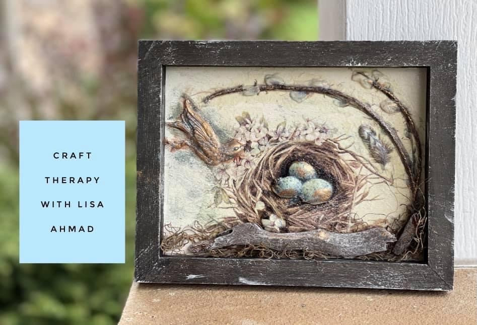 Decoupage birds nest with blue eggs in wood frame using decoupage napkins