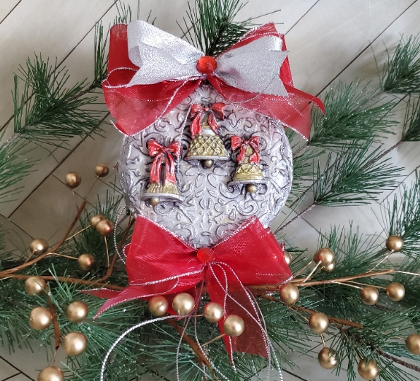 Faux tin christmas ornament with gold and silver bells and red ribbon at DecoupageNapkins.com