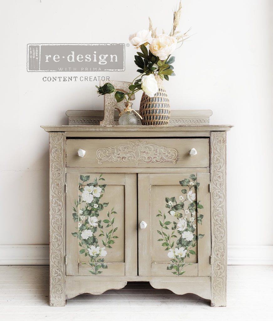 Tan wood cabinet with green ivy and white flowers using Decor Transfers Rub on Furniture Transfers