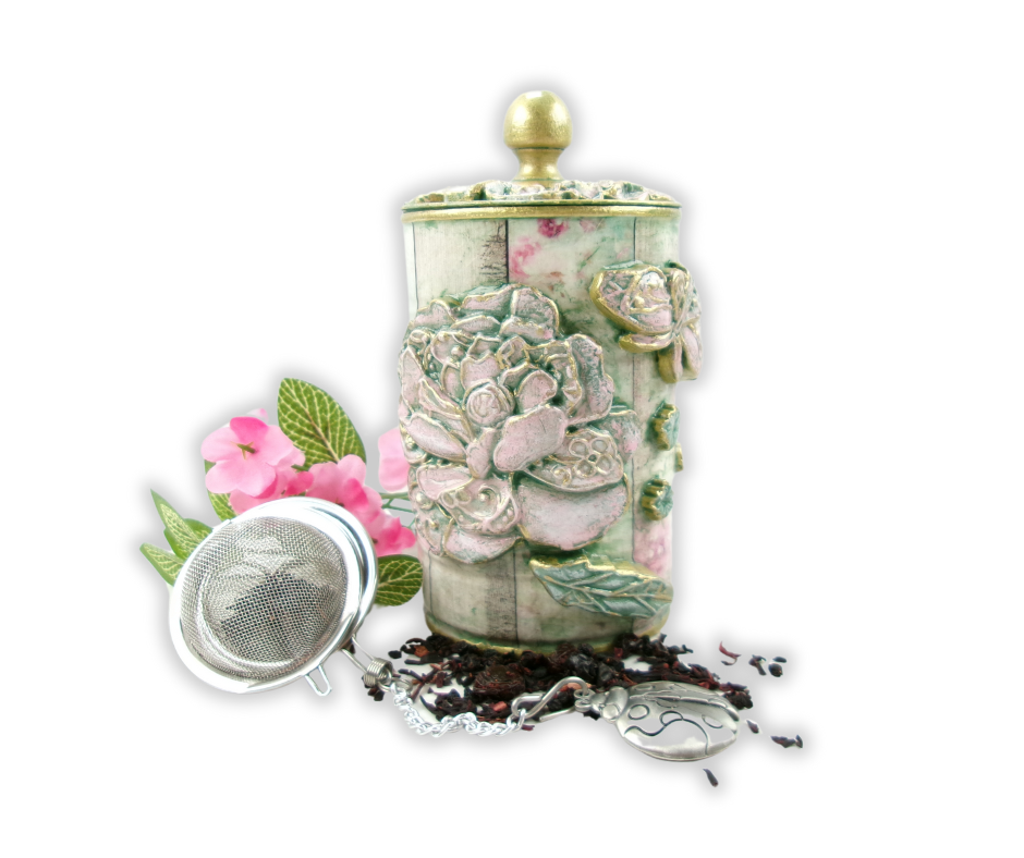 Tin Can Decoupaged with rice paper, floral molds and painted green and pink.