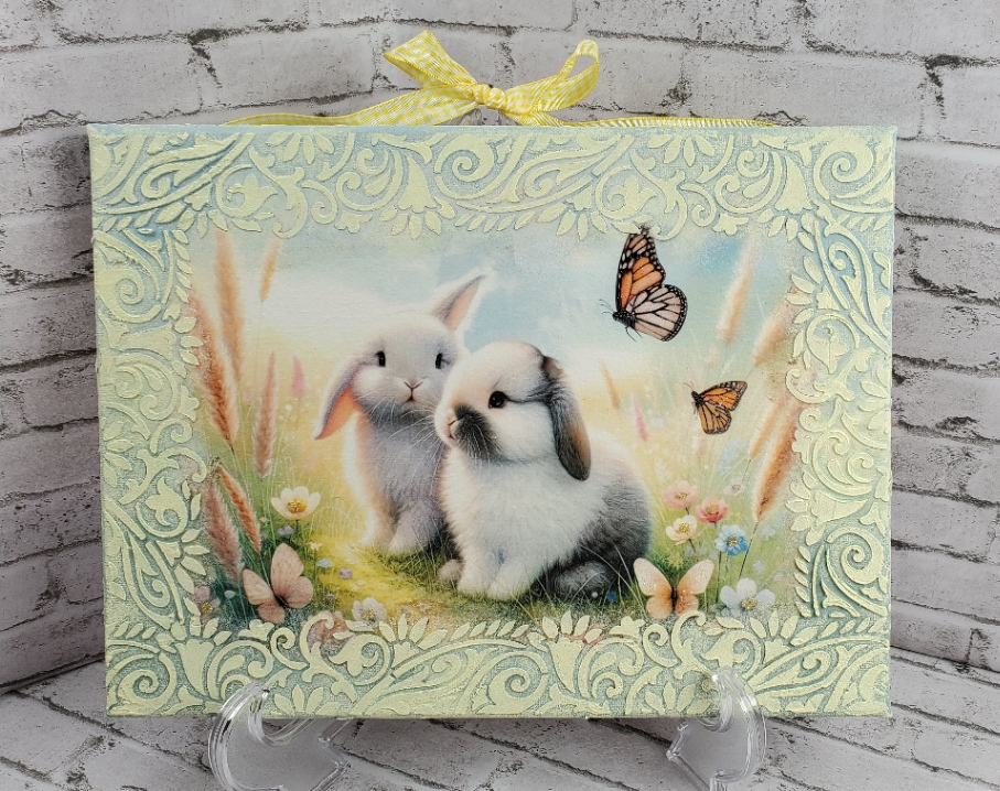 two cute bunnies in white and gray with monarch butterflies on a green and yellow spring flower canvas mixed media art