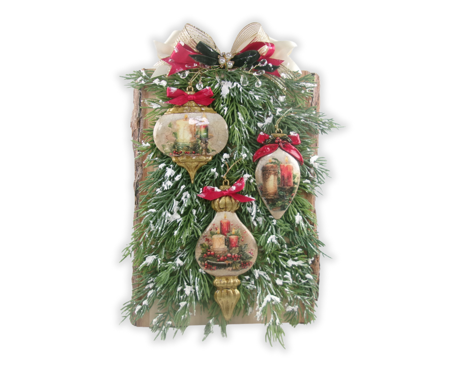 live-edge wood Christmas plaque decorated with faux evergreen branches, three clay ornaments decoupaged with candle rice paper, red satin bows, and snow-dusted accents, styled with silver berry sprigs for festive holiday décor