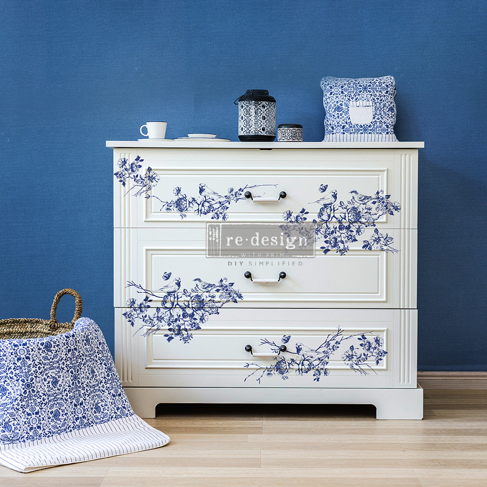 White Dresser with Blue floral rub on furniture transfer. Decorative Furniture Decals is the perfect Decor Transfer for DIY Upcycle and Mixed Media Art