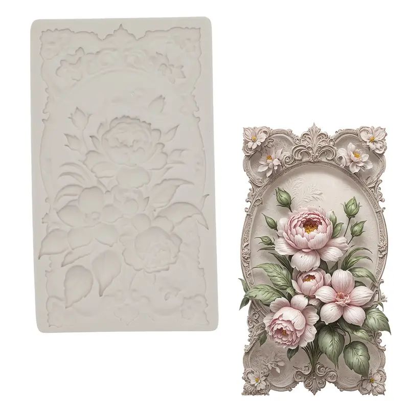 Accent silicone mold with flowers in front of ornate oval frame.