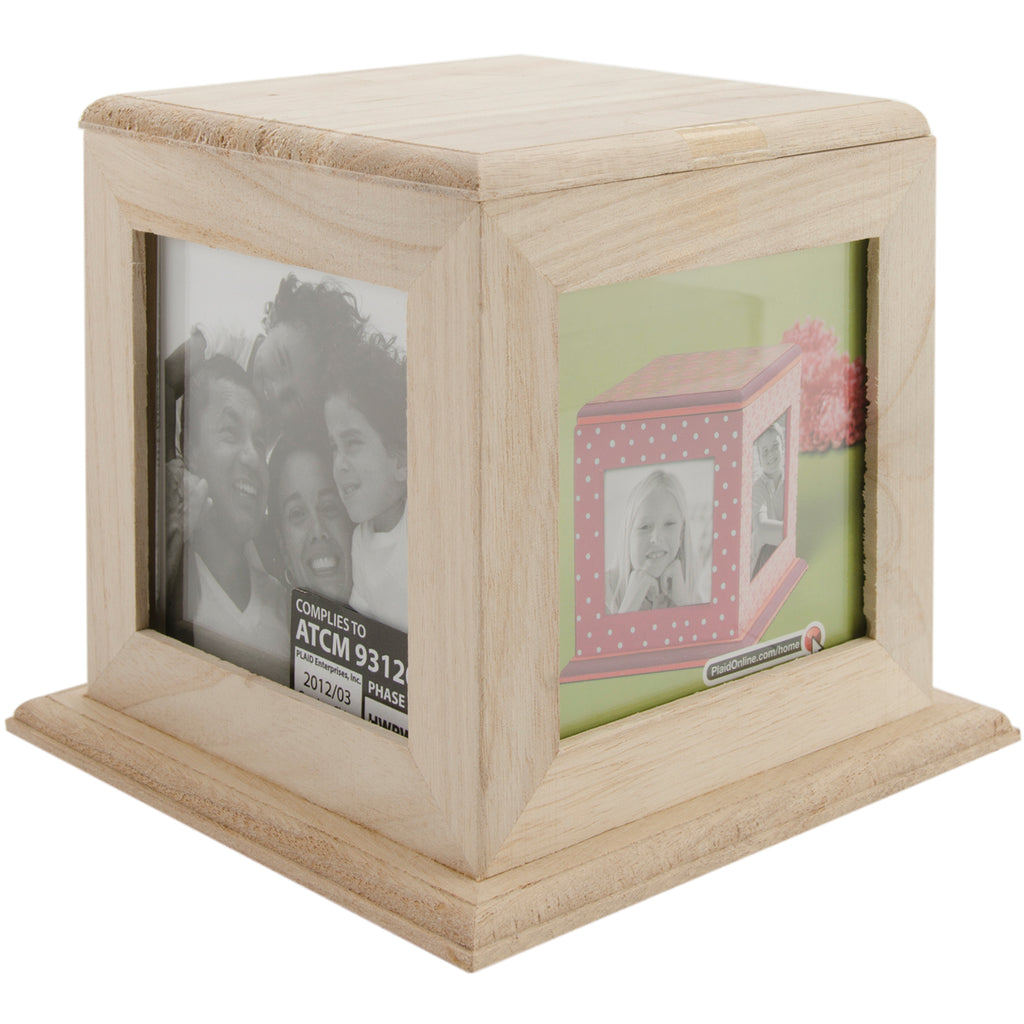 Wooden photo cube with embedded photos on a white background