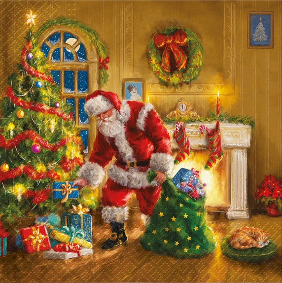 Santa putting presents under a tree with green bag and yellow cat in front of a  fireplace Decoupage Napkins