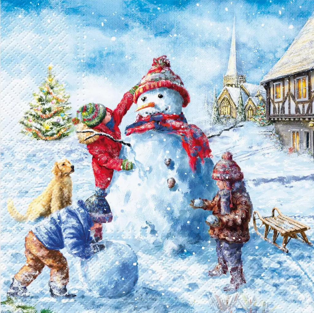 children make a snowman with red hat and scarf in snow in town Decoupage Napkins