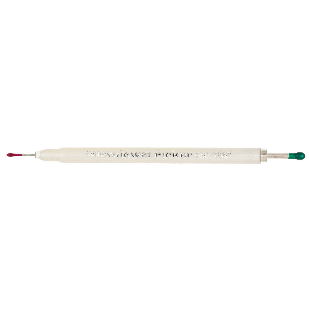 White jewel picker tool with red and green accents on a white background