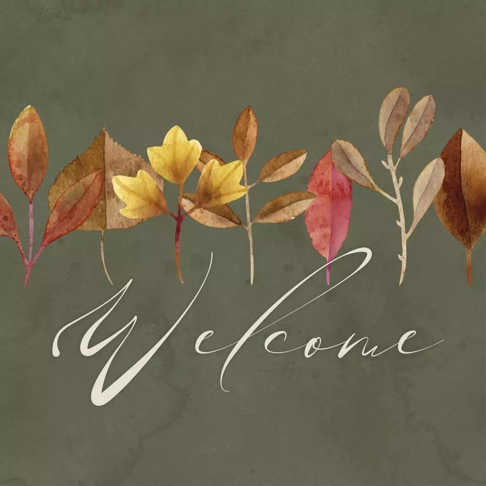 Autumn leaves with the word 'Welcome' on a green background