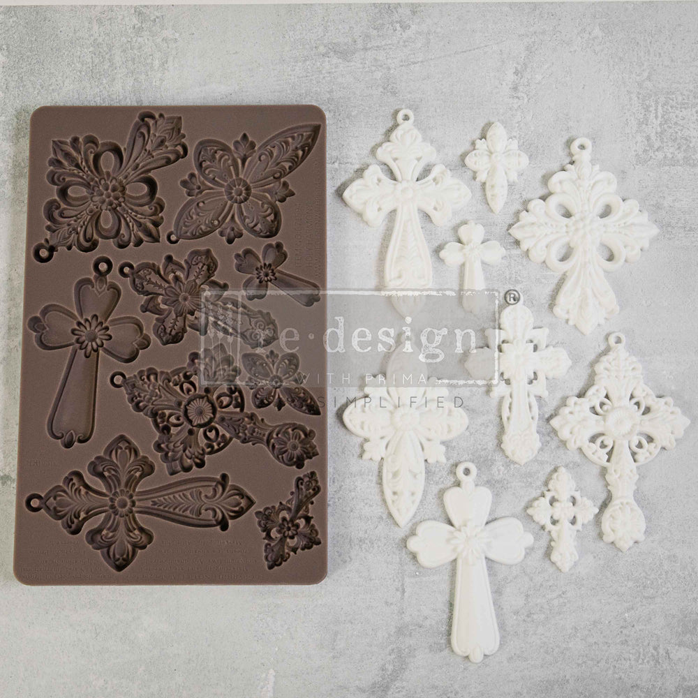 Brown silicone mold of religious cross from Redesign with Prima