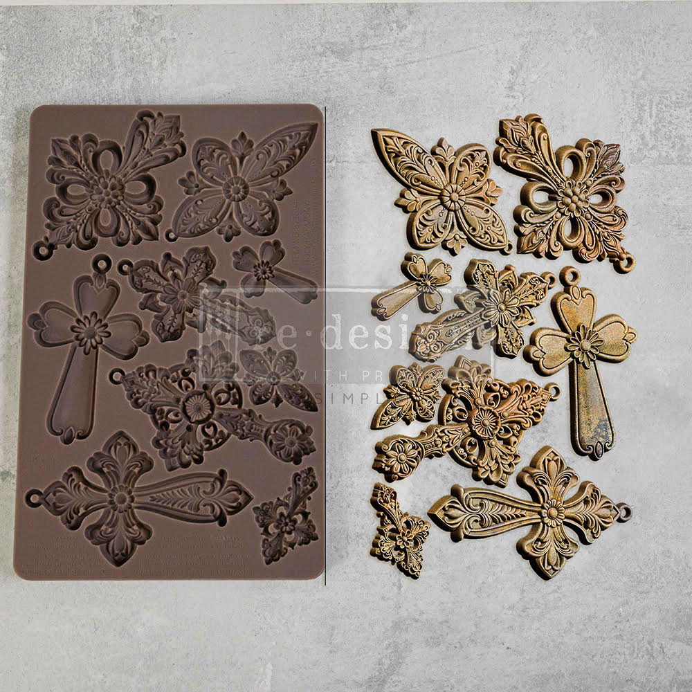 Brown silicone mold of religious cross from Redesign with Prima