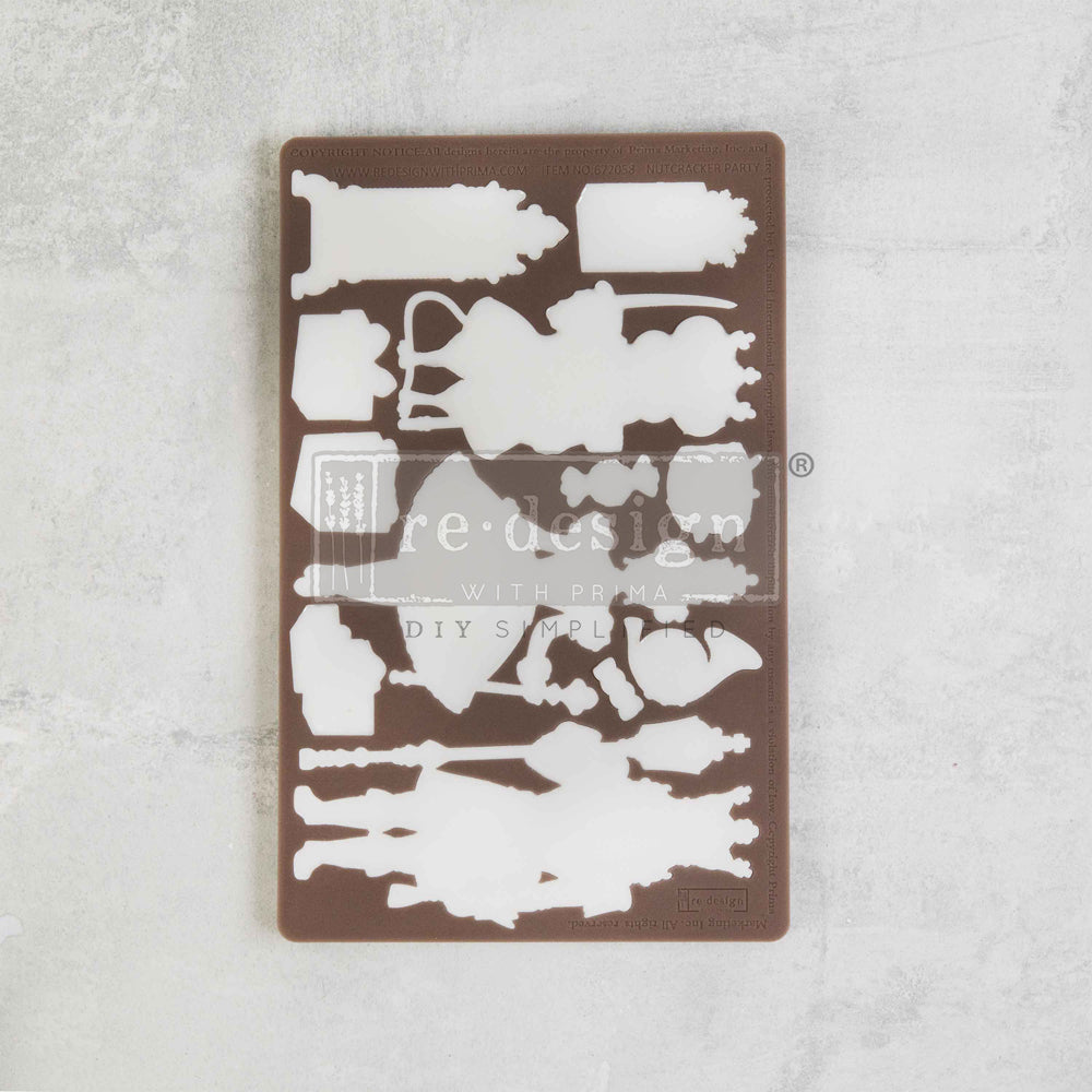 Brown silicone mold of nutcracker with ballet characters and presents from Redesign with Prima