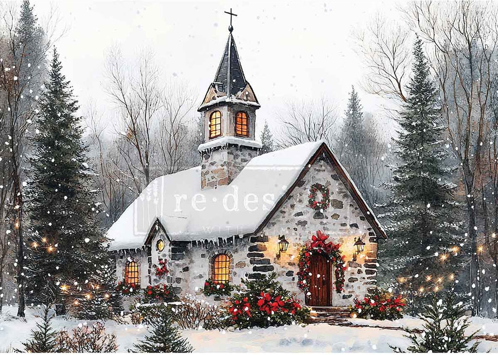 Snow-covered church with festive decorations in a winter landscape
