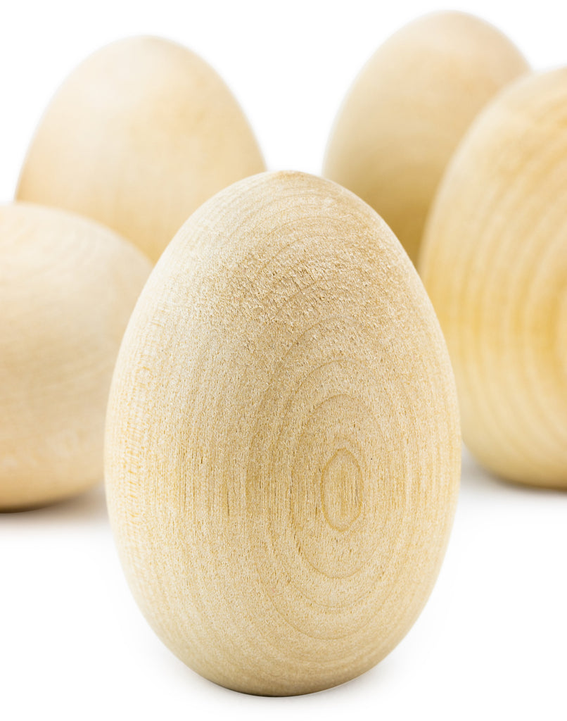 Close-up of wooden eggs on a white background