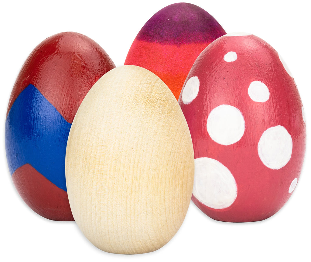Colorful wooden eggs on a white background