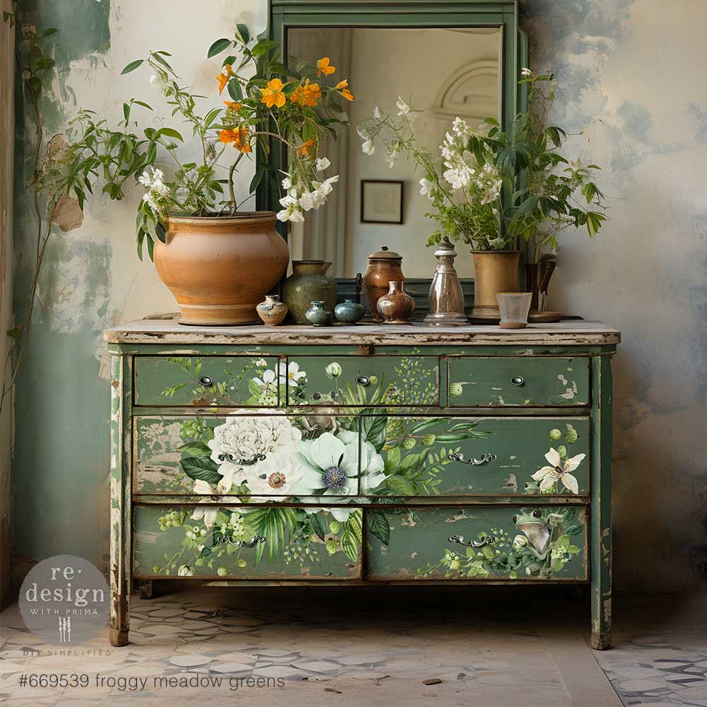 Dresser with white and green floral rub on transfer by ReDesign with Prima. Small green frogs on flowers.