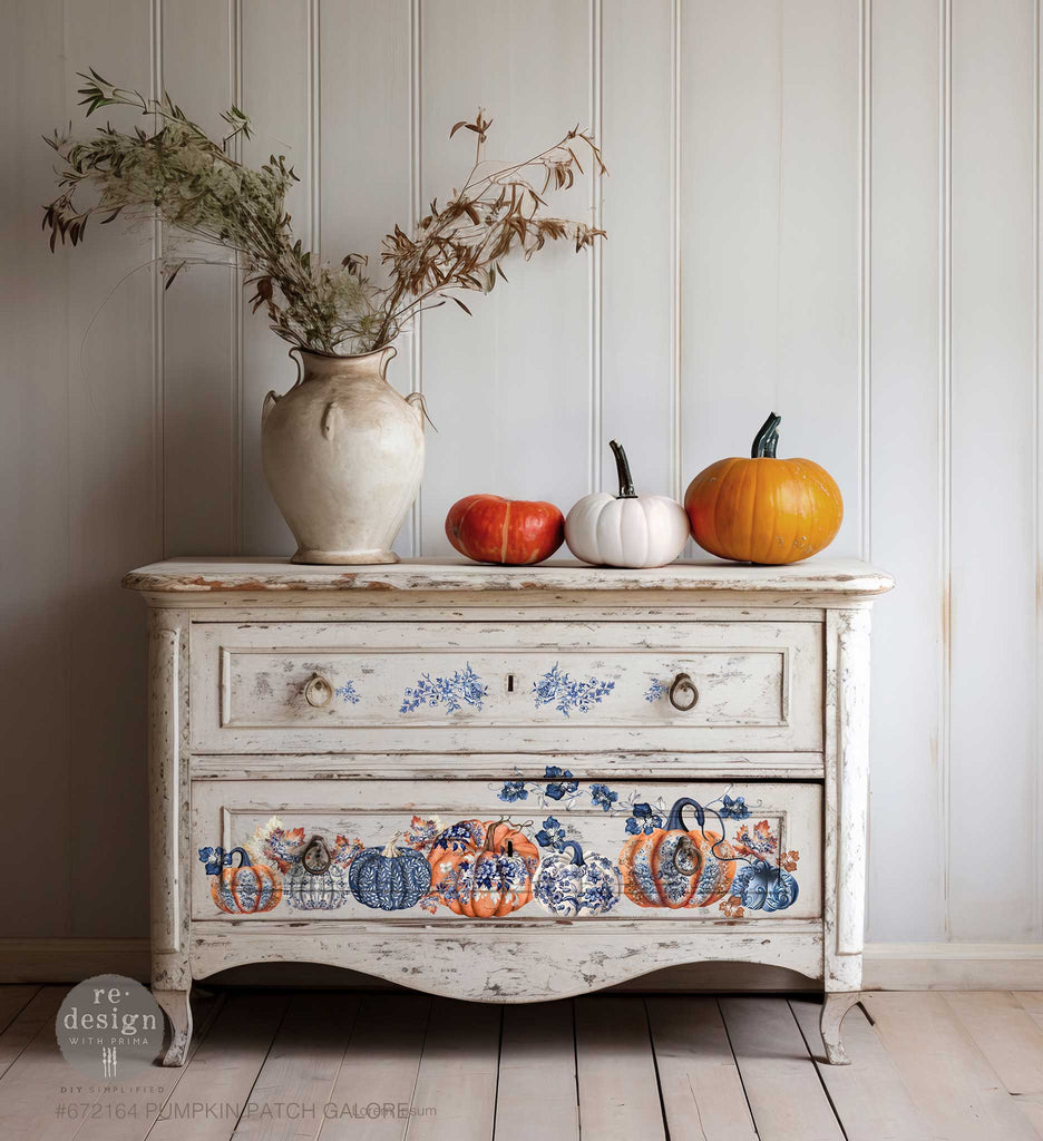 Rub on transfer with fall designs centered around pumpkins and leaves in varying colors and sizes. From traditional orange pumpkins to blue and white ones adorned with gorgeous blue floral prints