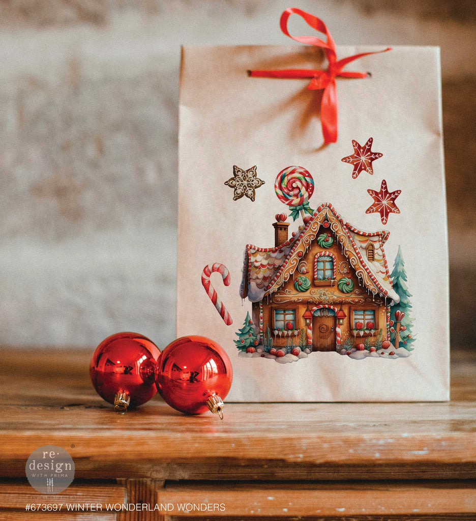 Redesign Prima Rub on transfers with picturesque scenes of cozy cottages, vintage red trucks, and festive holiday elements like gingerbread men, poinsettias, and candy canes. 