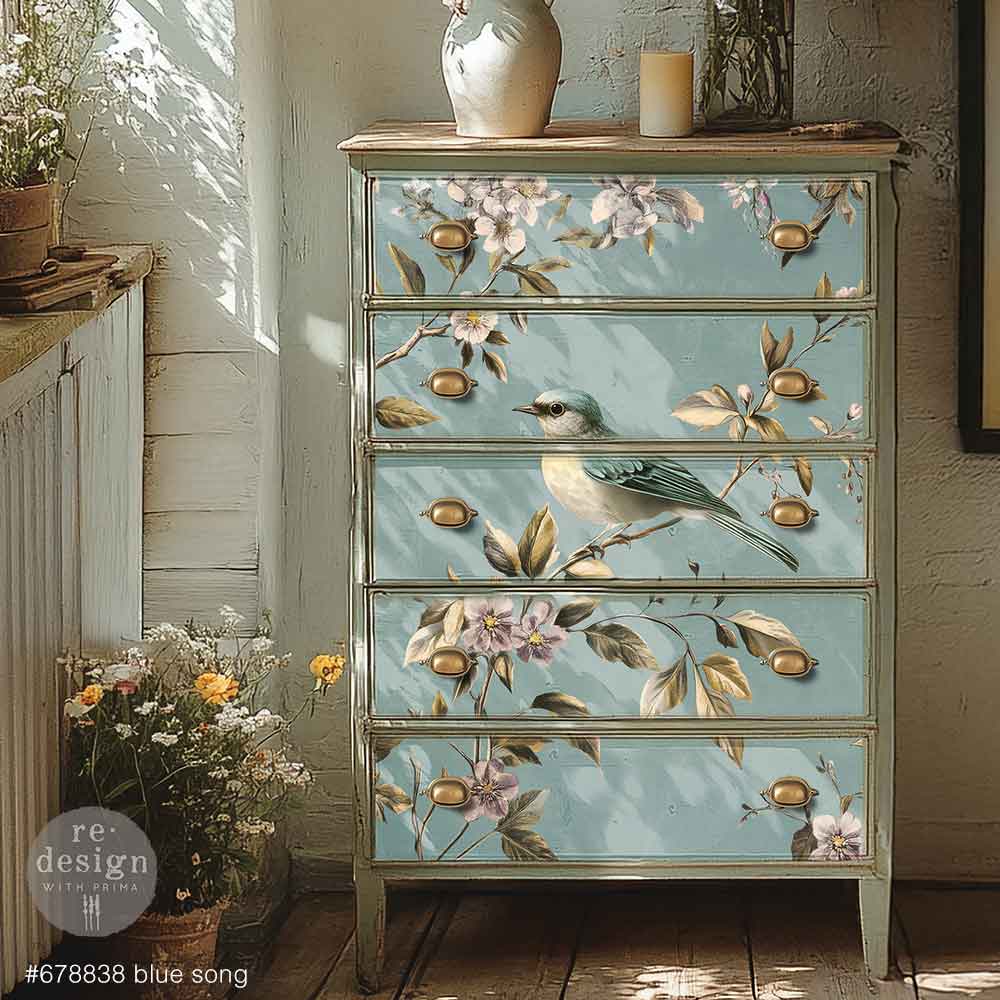 Blue and white bird perched on branch of purple flowers with blue background. A1 size fiber decoupage paper by Redesign with Prima. 