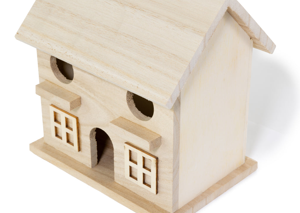 Wooden model of a house on a white background