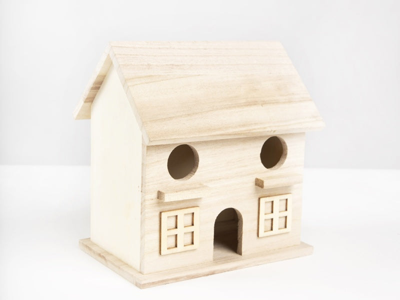 Wooden birdhouse with circular entrance on a white background