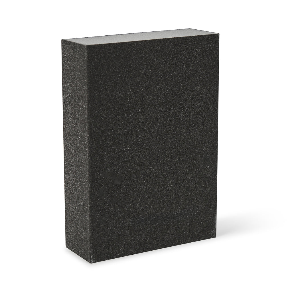 Black rectangular sanding block on a white background