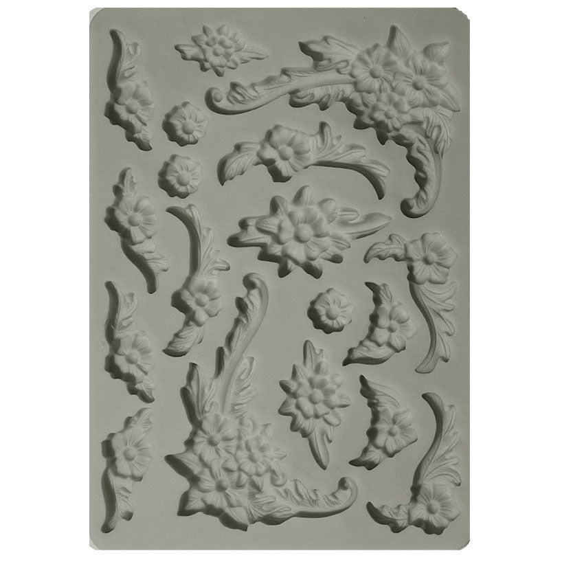 Gray Stamperia silicone mold with flower shapes and floral corner shapes.