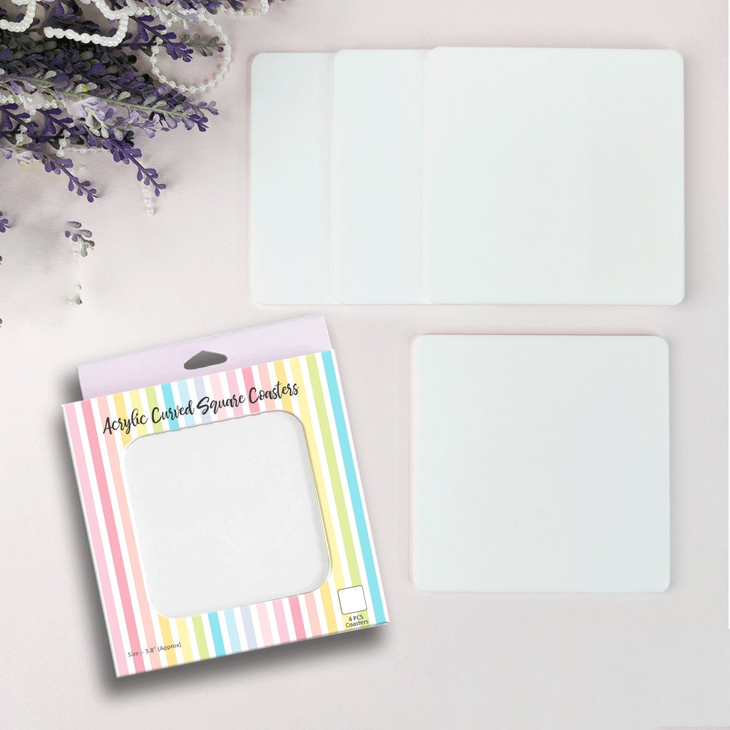 Four white 4" rounded corner square coasters by Dress My Craft.