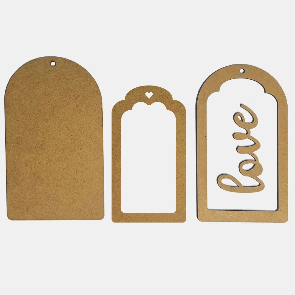 Three MDF wood  tags of different shapes and sizes on a white background
