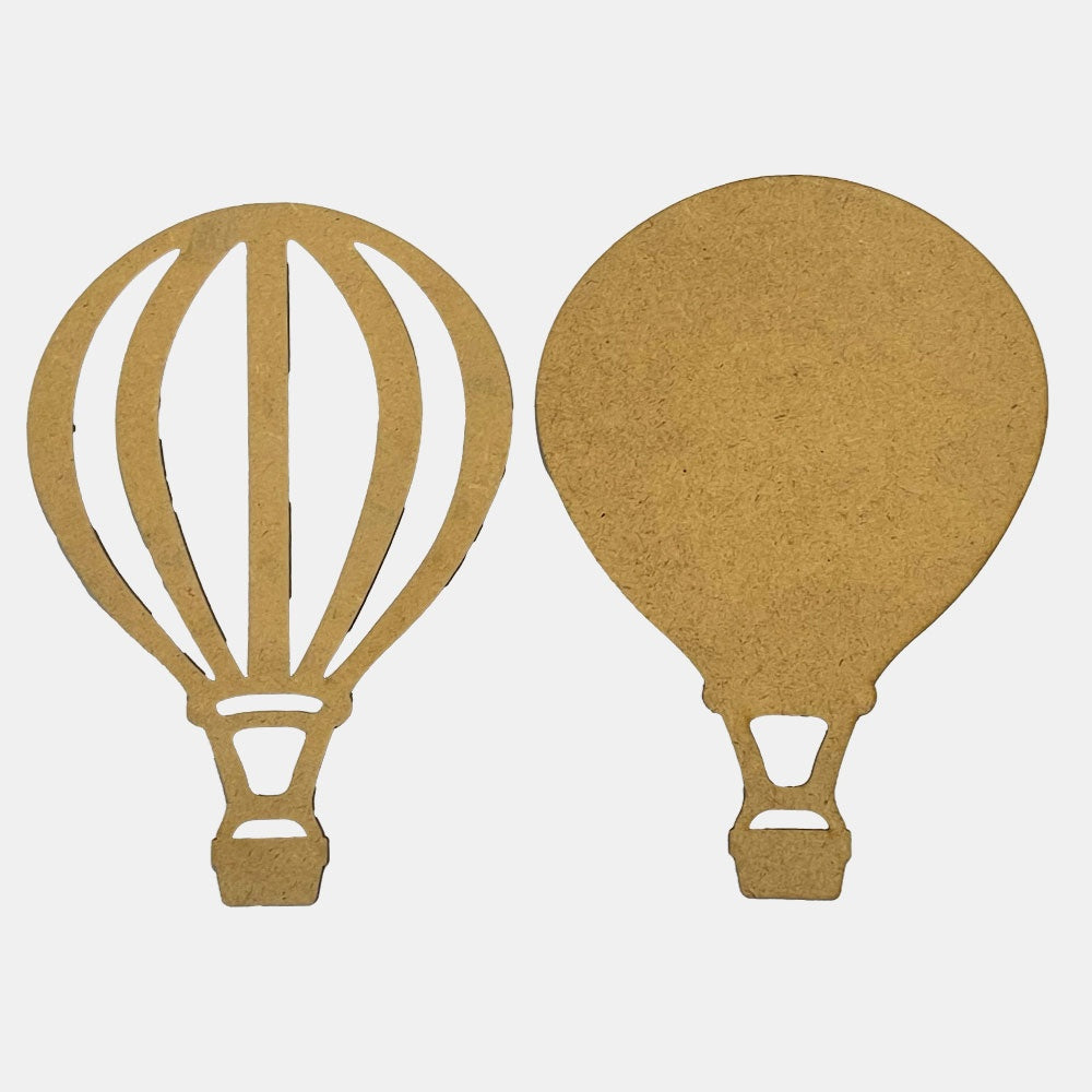 Two MDF wood cutouts of hot air balloons on a white background