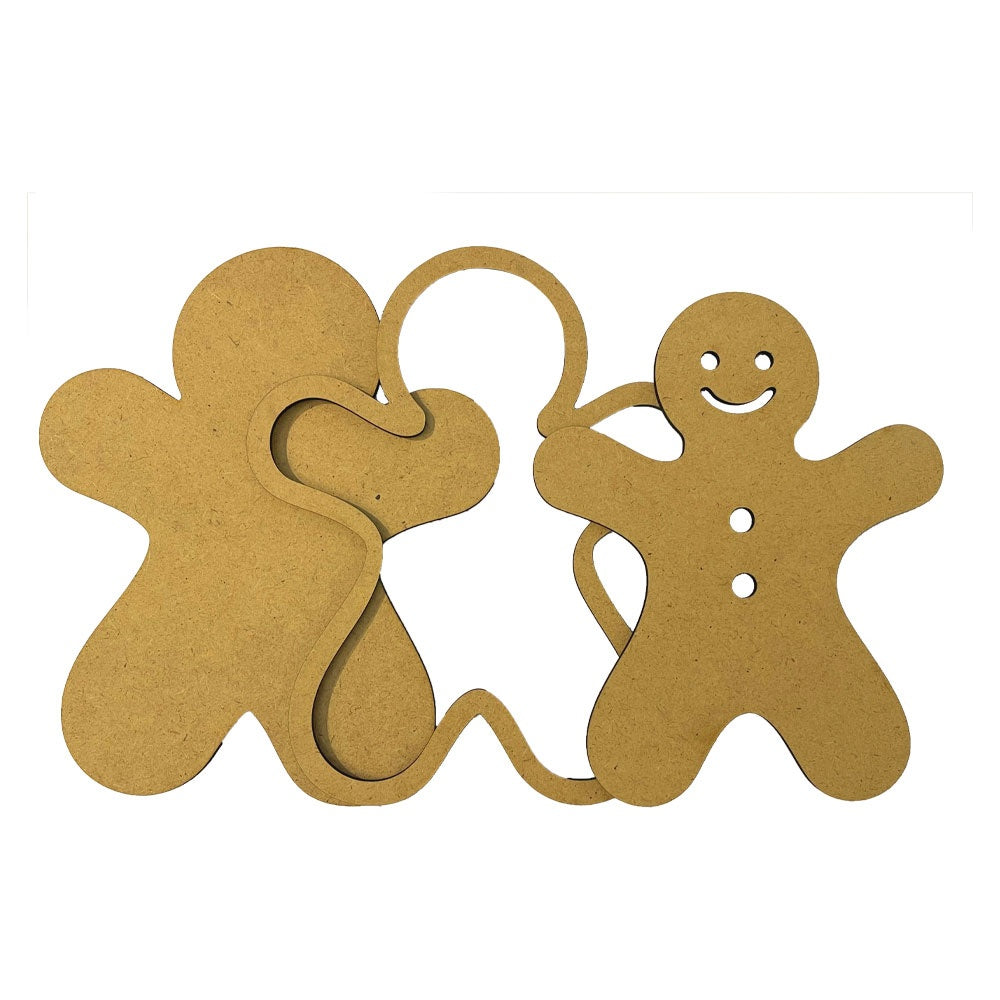 Two brown MDF wood gingerbread men cutouts on a white background