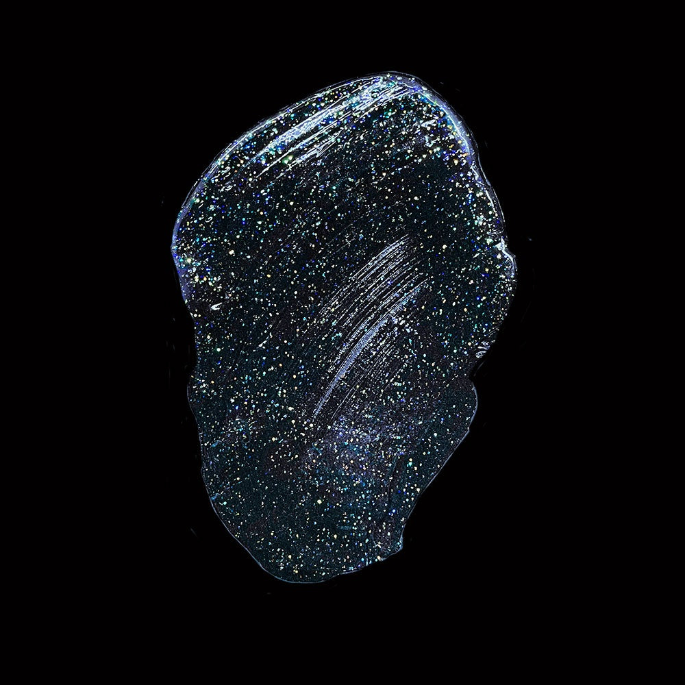 Shiny, dark blue glittery substance on a black background