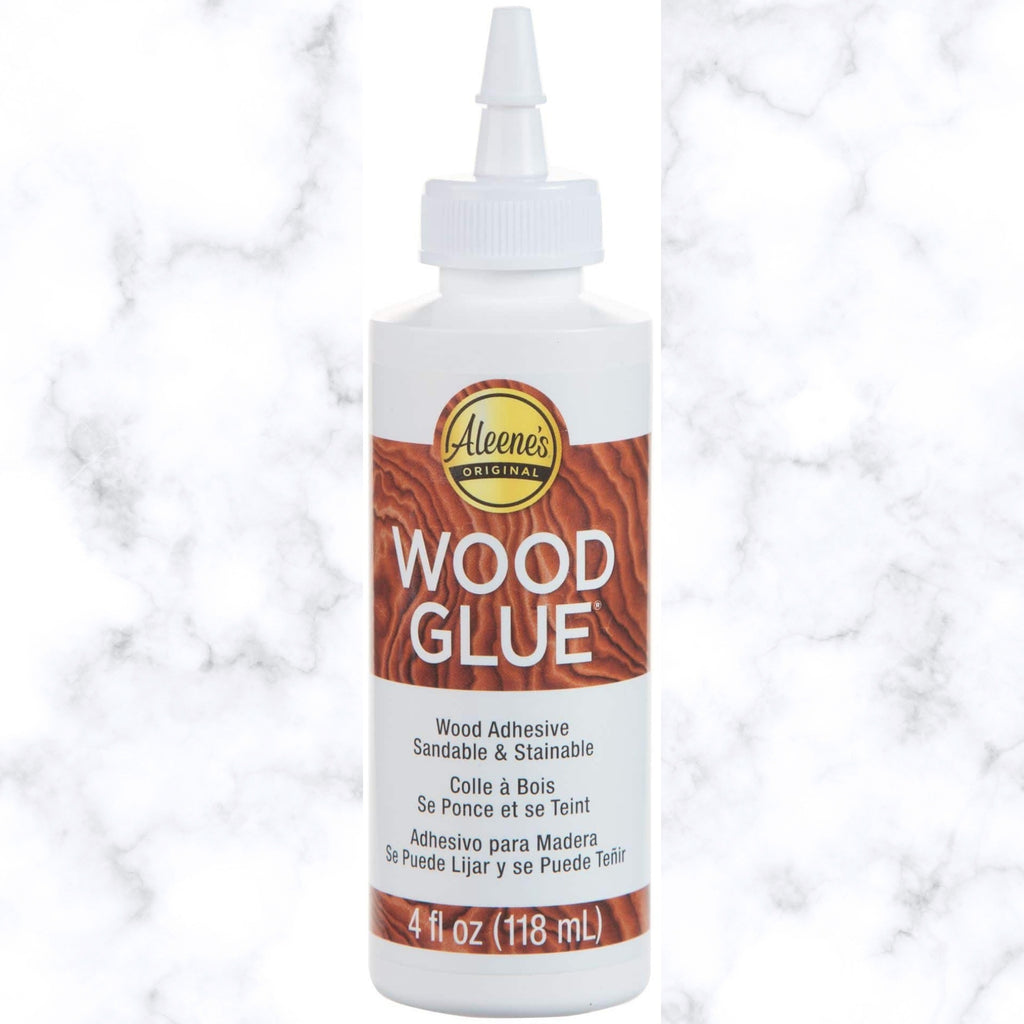 4 oz bottle of Aleene's Wood Glue with brown label