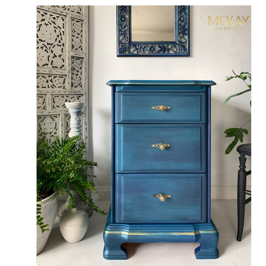 3 drawer cabinet painted with Dixie Belle Moonshine Metallics paint in the color Caribbean, a teal shade.