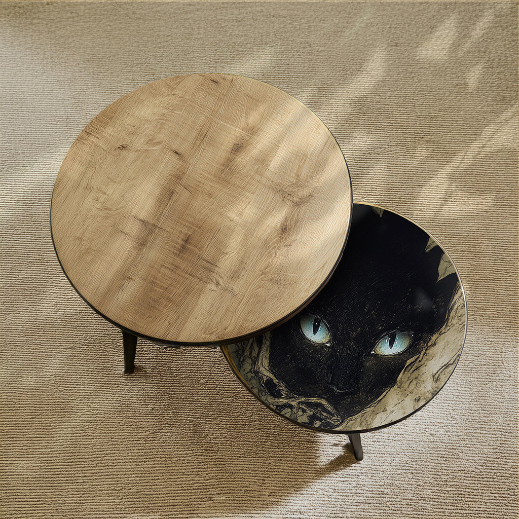 Round wooden table and round glass table with cat design on a textured surface