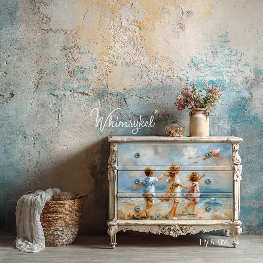 Decorative dresser with beach-themed painting against a textured wall.