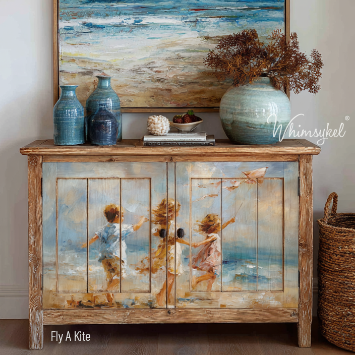 Decorative wooden cabinet with beach-themed design and Whimsykel branding.