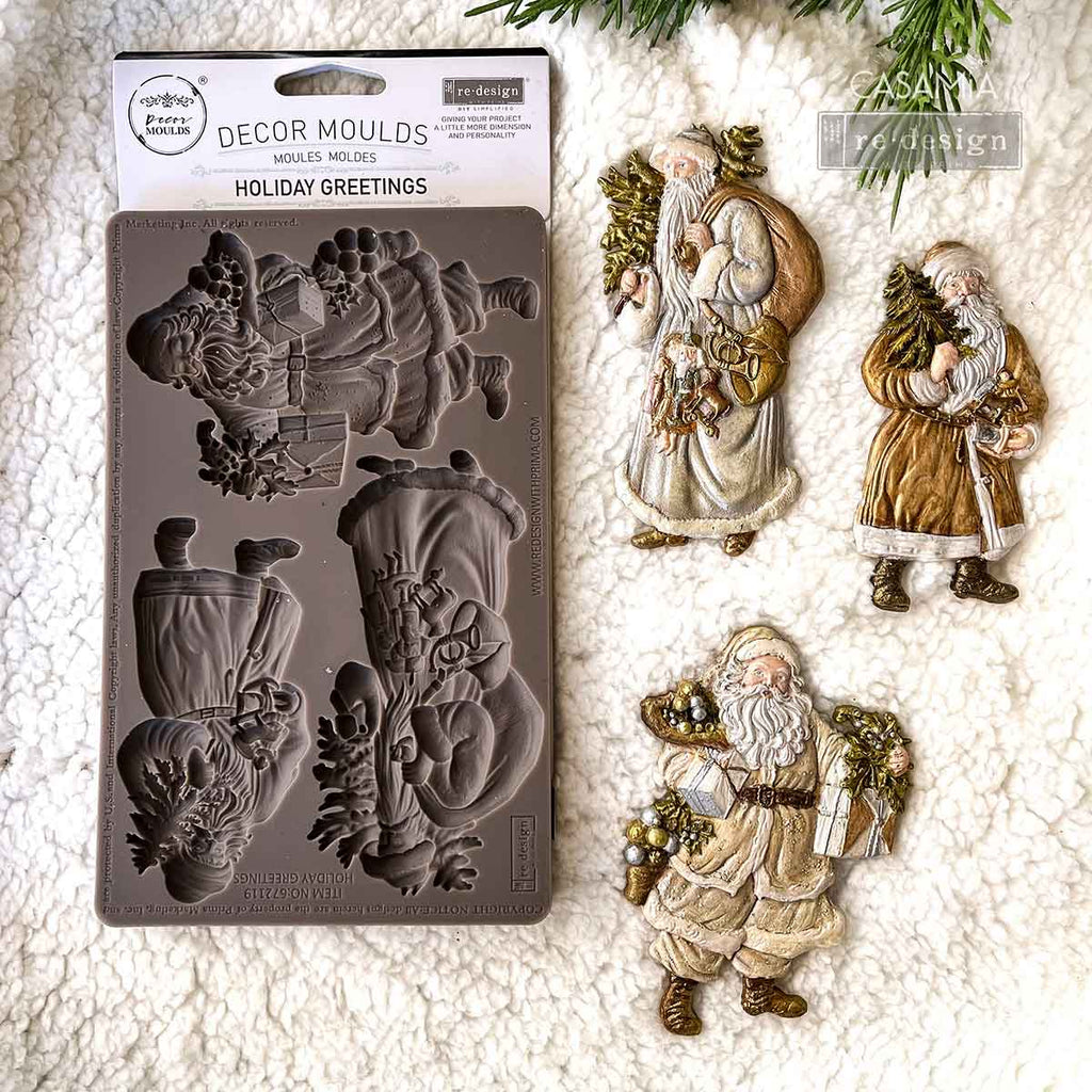 Redesign with Prima Holiday Greeting mold with 3 figures; Santas carrying greenery and presents