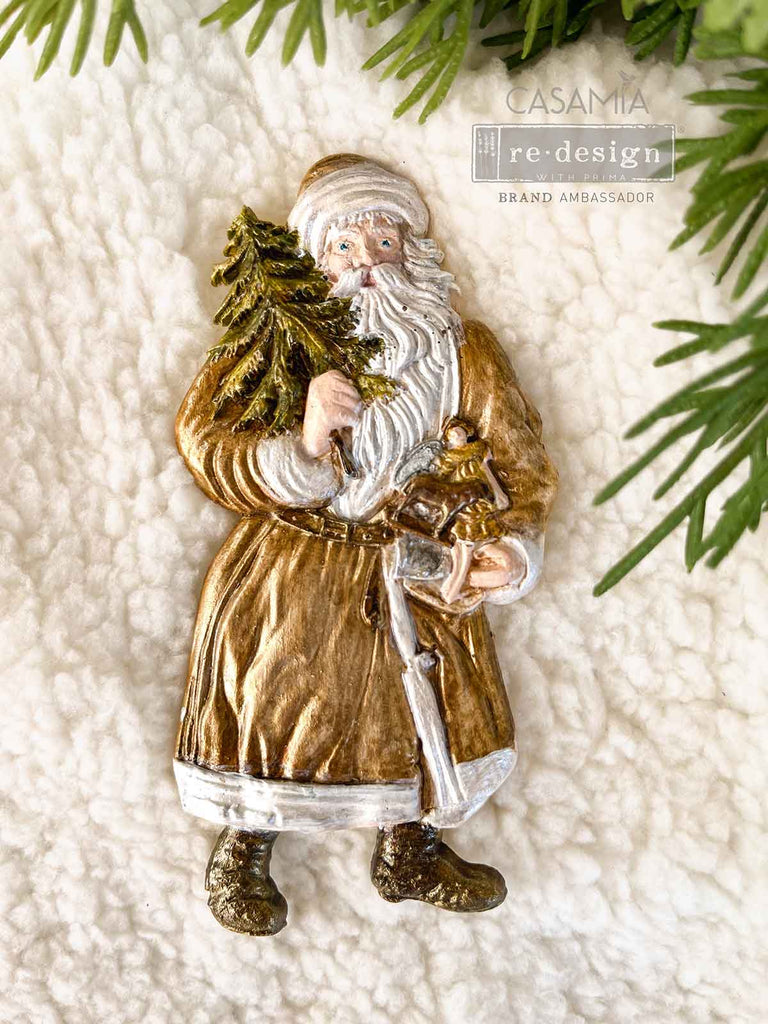 Redesign with Prima Holiday Greeting mold with 3 figures; Santas carrying greenery and presents