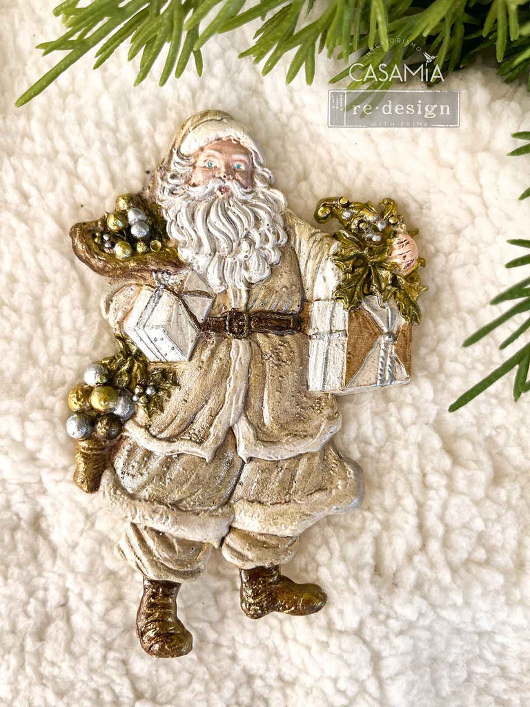 Redesign with Prima Holiday Greeting mold with 3 figures; Santas carrying greenery and presents