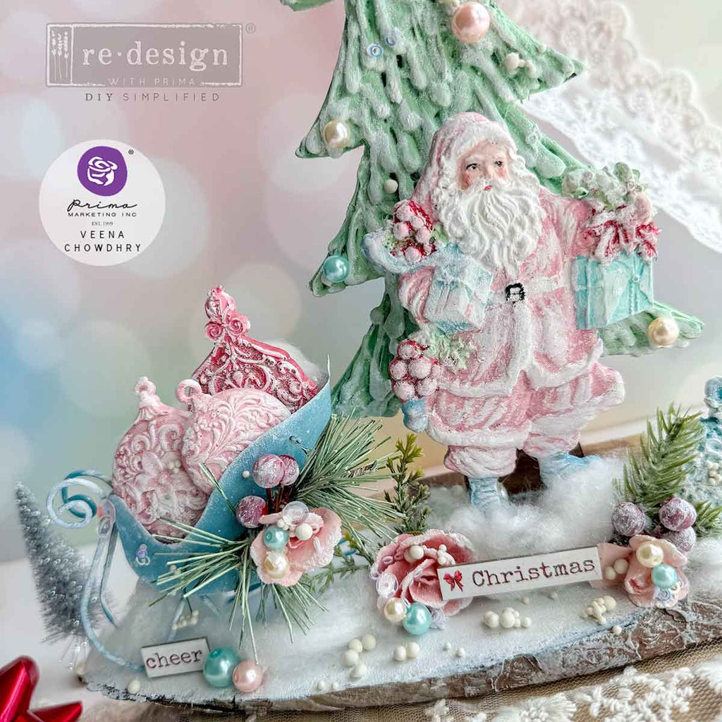 Redesign with Prima Holiday Greeting mold with 3 figures; Santas carrying greenery and presents