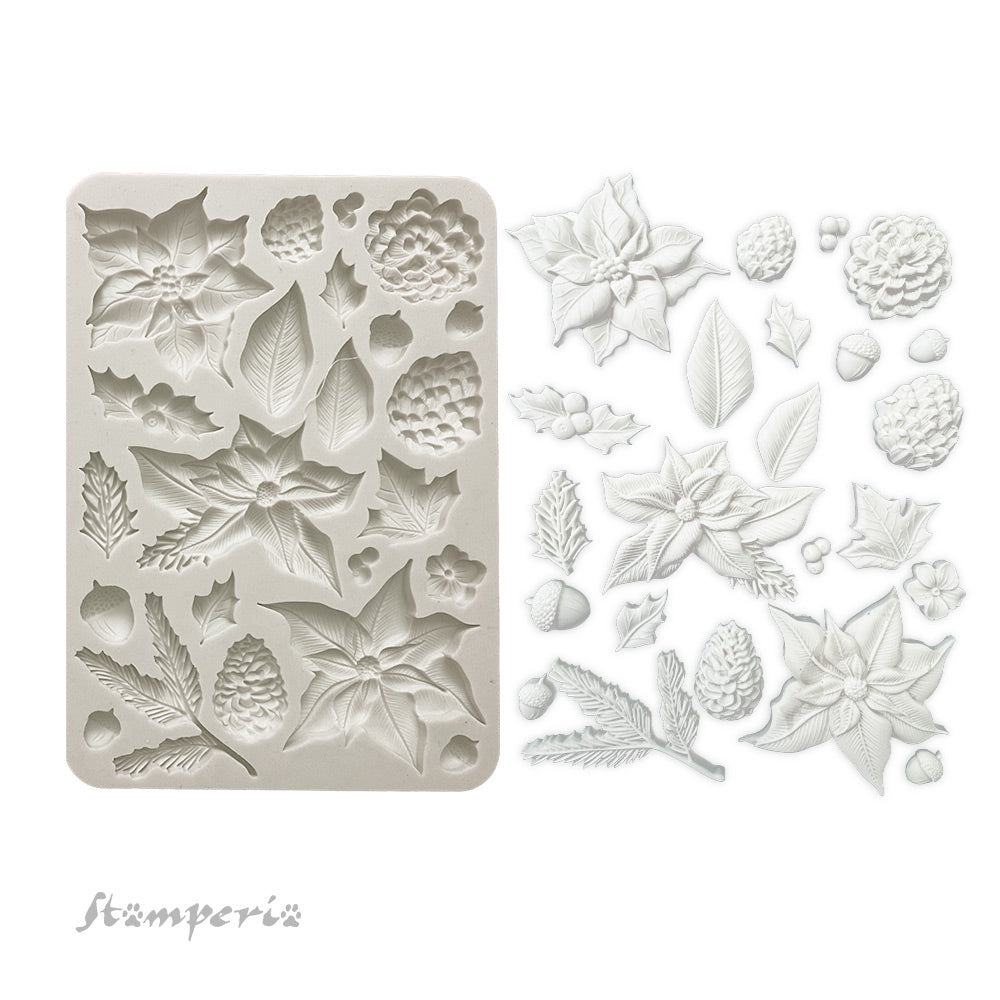 Gray Stamperia silicone mold with poinsettias pinecones greenery and acorns.