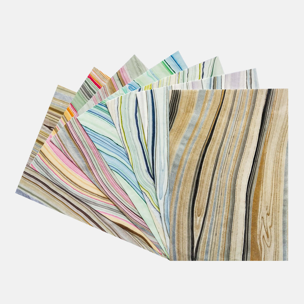 collection of marbled decoupage rice paper from KOZO with blue pink yellow and black