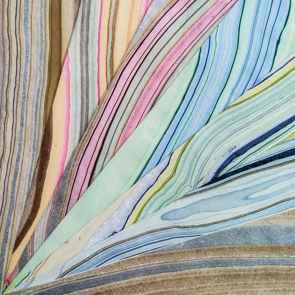 collection of marbled decoupage rice paper from KOZO with blue pink yellow and black