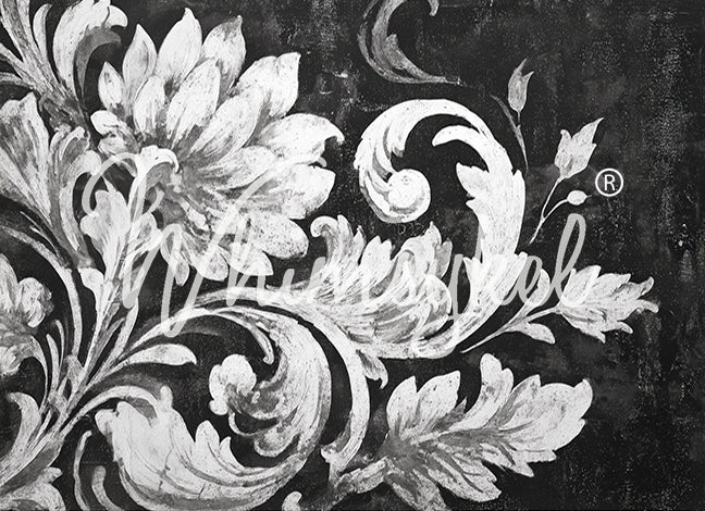 Decorative floral design with swirling patterns on a dark background