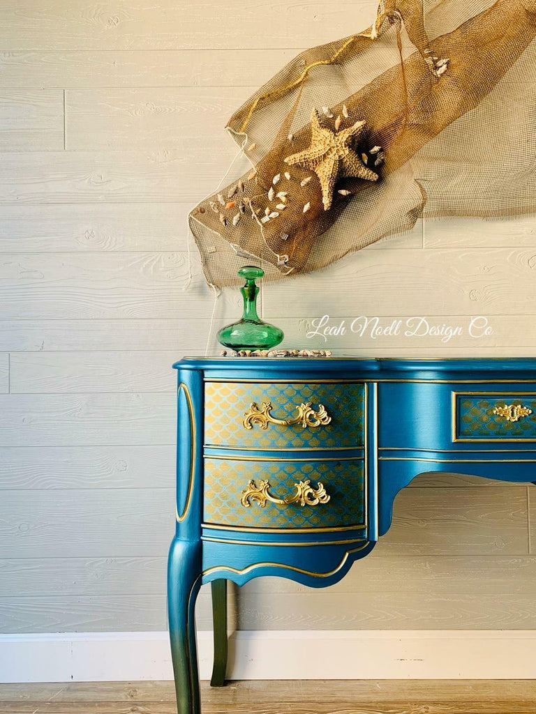 Table painted with Dixie Belle Moonshine Metallics paint in the color Pacific, a bright blue shade.
